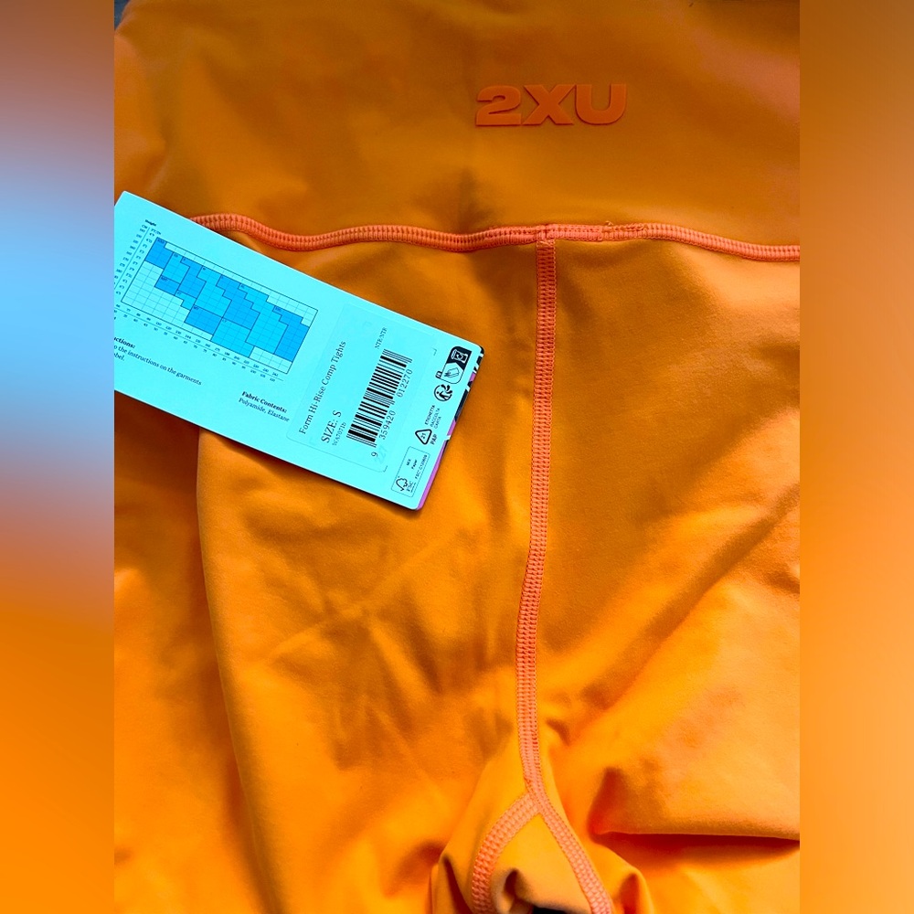Orange 2XU form stash high rise compression tights
